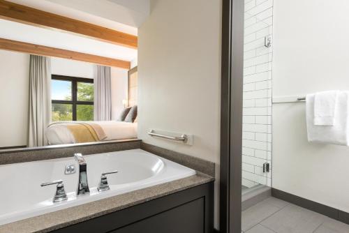 a bathroom with a sink and a mirror at Friday Harbor House in Friday Harbor