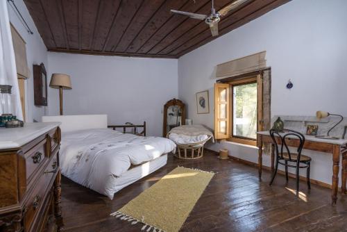 Katil atau katil-katil dalam bilik di MK Cottage With Breakfast and Jacuzzi