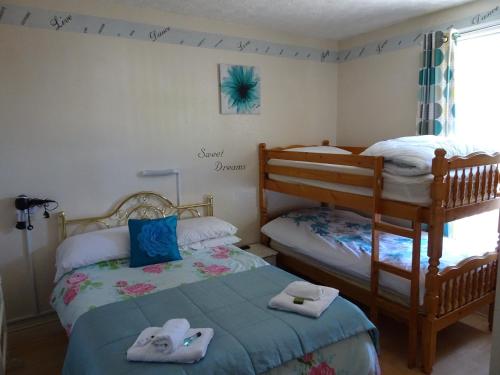 Postel nebo postele na pokoji v ubytování The Osprey Hotel