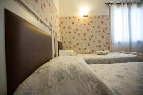 Postel nebo postele na pokoji v ubytování Pegasus Rooms