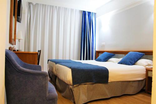 Posteľ alebo postele v izbe v ubytovaní Hotel Marbel