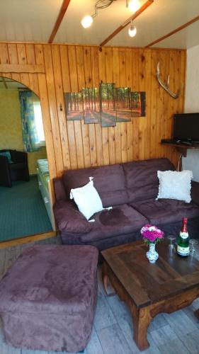 a living room with a couch and a coffee table at Bungalow in strandnähe in Mönkebude