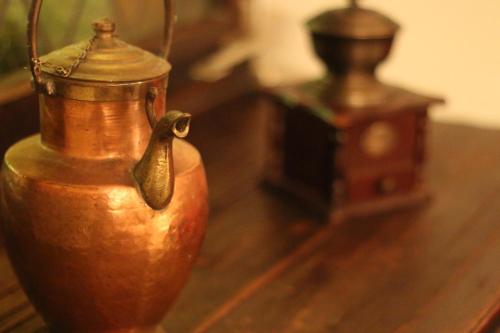 a close up of a wooden table with a jug on it at Hotel Sudpfanne in Heidelberg