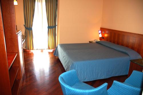 Cama o camas de una habitación en Hotel Michelangelo Palace & SPA