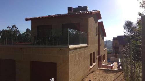 a building with a window on the side of it at Top Sanxenxo Resort in Sanxenxo