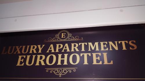 a sign that reads luxury apartments antiquated at Luxury Apartment Eurotel in Struga