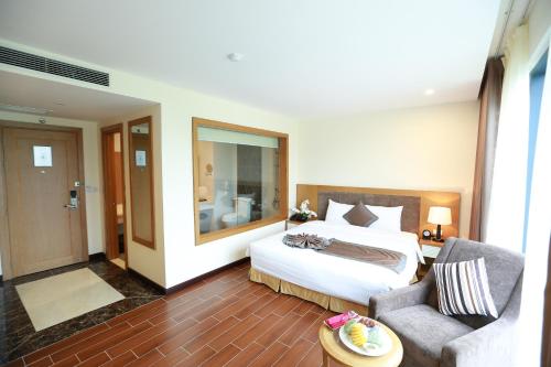 Voodi või voodid majutusasutuse Muong Thanh Holiday Con Cuong toas