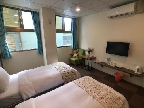 Postel nebo postele na pokoji v ubytování Chang Ti Metropolis Commercial Hotel