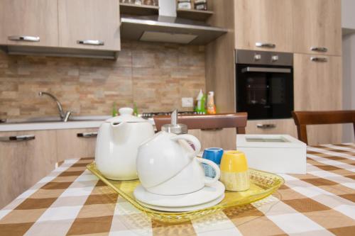 a kitchen with two tea pots on a table at Rifugio Massafera 2 in Massafra
