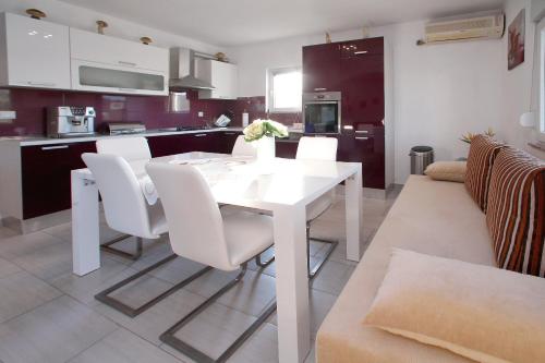 Kuchyň nebo kuchyňský kout v ubytování Apartment Palma