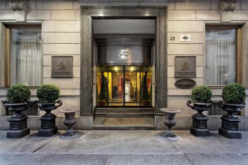 a building with a entrance to a store at Grand Hotel Sitea in Turin