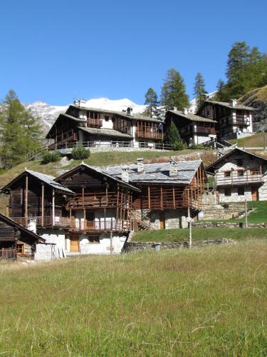 a large building on top of a hill at Il Piccolo Residence in Gressoney-la-Trinité