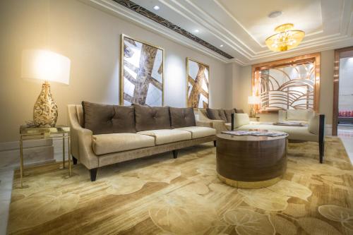 a living room with a couch and a coffee table at Winford Resort and Casino Manila in Manila