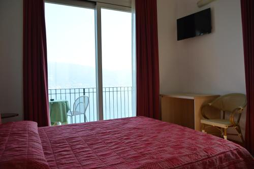Postel nebo postele na pokoji v ubytování Hotel La Terrazzina