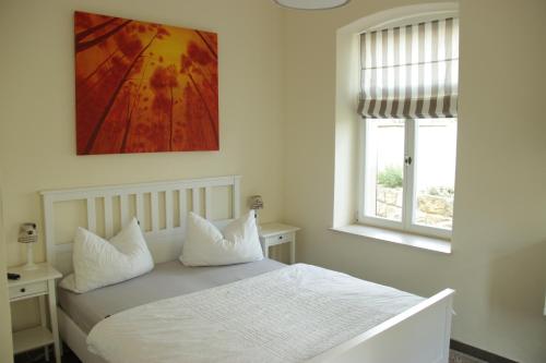 Ein Bett oder Betten in einem Zimmer der Unterkunft Ferienwohnung an der Elbe
