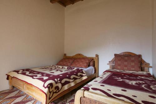 Cama o camas de una habitación en Tamatert Guest House