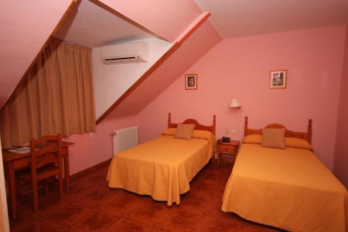 Hotel Rural Montaña de Cazorlaにあるベッド