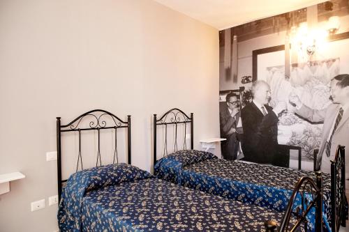 Cama ou camas em um quarto em Hotel Ospite Inatteso