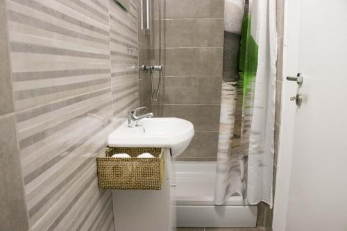 a bathroom with a sink and a shower at Apartment Lorena in Sevid