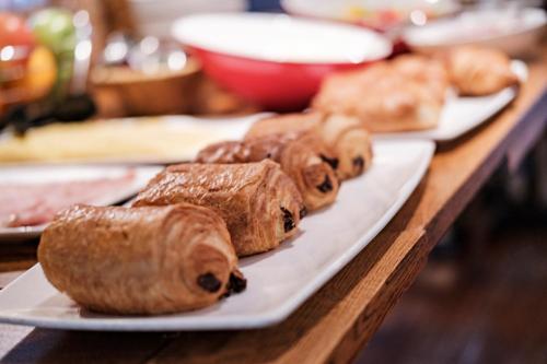 a group of pastries on a plate on a table at The Hampshire Hog in Clanfield