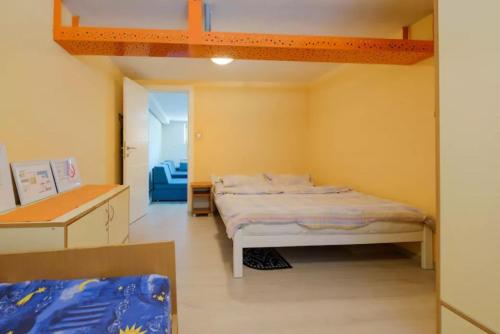 a bedroom with a bed in a room with a loft at Apartment Fontana in Belgrade