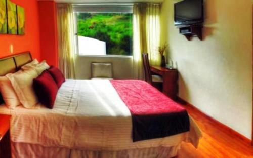 Ένα ή περισσότερα κρεβάτια σε δωμάτιο στο Kur Hotel & Bio Spa