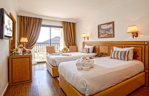 Postel nebo postele na pokoji v ubytování Royal Mirage Agadir