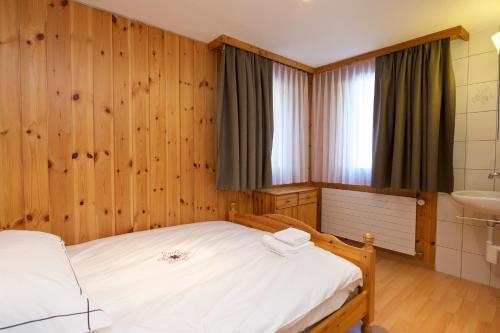 Ένα ή περισσότερα κρεβάτια σε δωμάτιο στο Chalet Felderhof