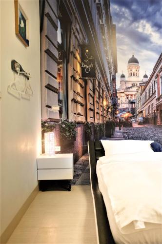 a city street with two beds on the side of a building at INg Hostel in Hualien City