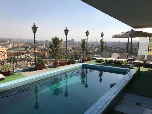 a swimming pool with a view of the city at Hotel Royal Marshal in Cairo
