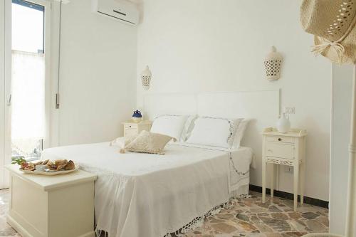 Postel nebo postele na pokoji v ubytování Dimora Cappuccini Guest House