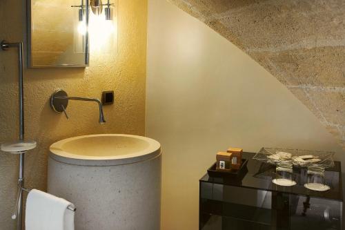 a bathroom with a toilet and a sink in it at Antica Civita Luxury Room in Matera