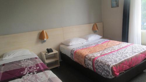 Postel nebo postele na pokoji v ubytování Hotel Belvedere