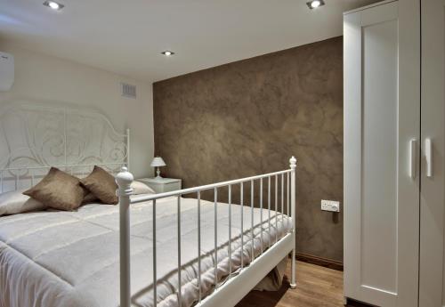 Кровать или кровати в номере Borgo suites - self catering apartments - Valletta - By Tritoni Hotels
