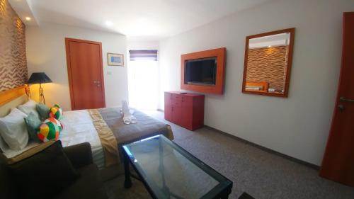 TV a/nebo společenská místnost v ubytování City Suites