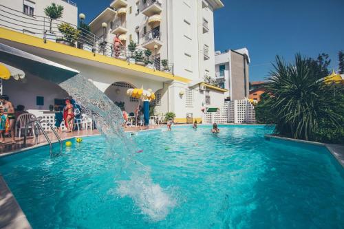 a pool at a hotel with a water fountain at Hotel Gardenia in Bellaria-Igea Marina