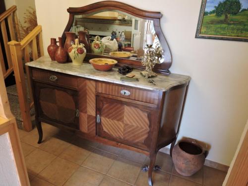 a dresser with a mirror on top of it at Casa Sierra de Gredos in Navasequilla