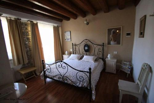 Ένα ή περισσότερα κρεβάτια σε δωμάτιο στο Albergo Julienne