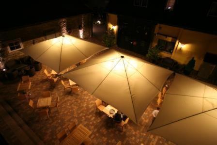 an overhead view of a living room with two large umbrellas at Goldener Adler in Sulzheim