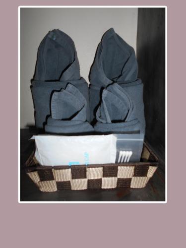 a basket filled with blue bags on a table at The Miracle Guesthouse & Diving in Koh Tao