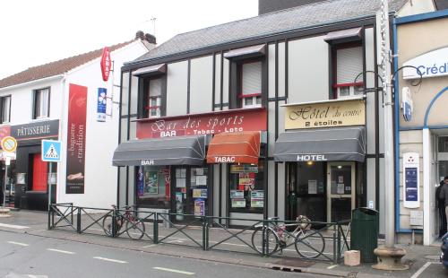 a group of shops on a city street at Hotel du Centre Lucé Chartres in Luce