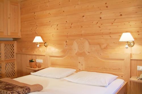 Postel nebo postele na pokoji v ubytování Hotel Gomagoierhof