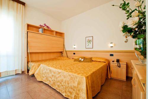 Postel nebo postele na pokoji v ubytování Hotel Jonni