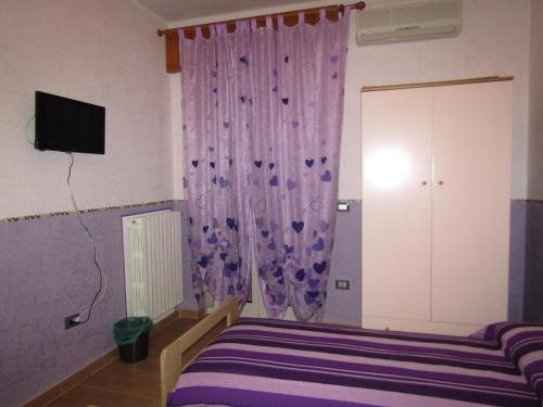 TV a/nebo společenská místnost v ubytování Dolce Dormire