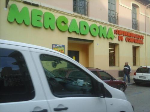 a white van parked in front of a store at Guesthouse Berna in Denia