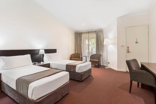 Karratha International Hotelにあるベッド
