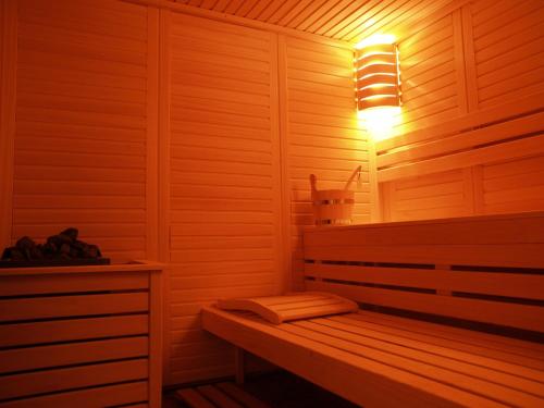 a sauna with a bench with a light on it at Premier Prezident Garni Hotel and Spa in Sremski Karlovci