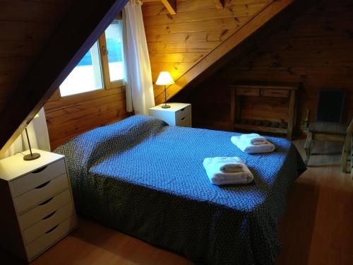 Säng eller sängar i ett rum på Cabaña San Martín de los Andes