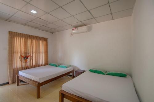 Postel nebo postele na pokoji v ubytování Wilpattu Holiday Home