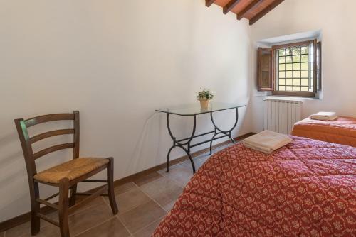 Postel nebo postele na pokoji v ubytování Agriturismo Casapasserini